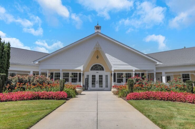 Exterior view of a senior living facility with flowers