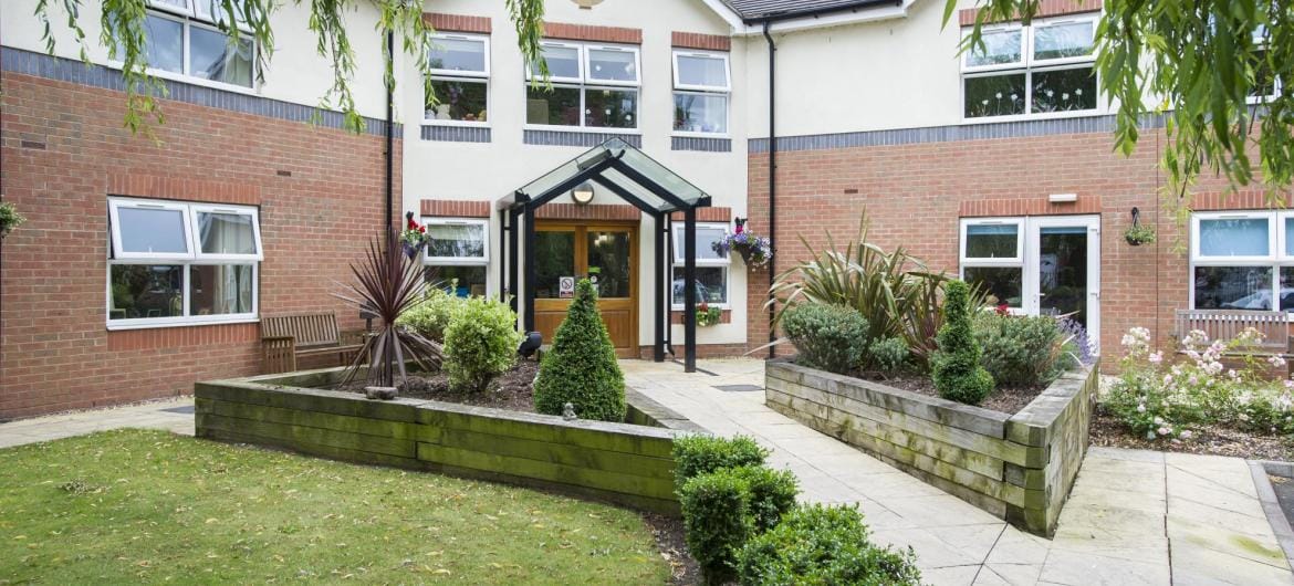 Exterior view of East Park Court with garden.