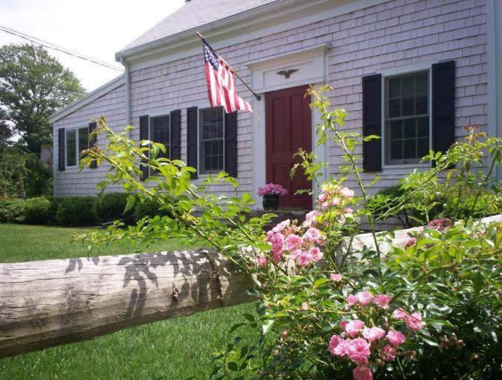 Exterior view of a senior living facility with flowers