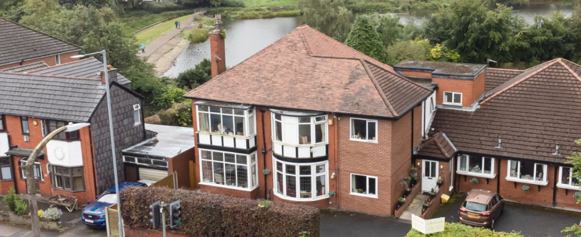 Aerial view of Glenbank Care Home building by a river