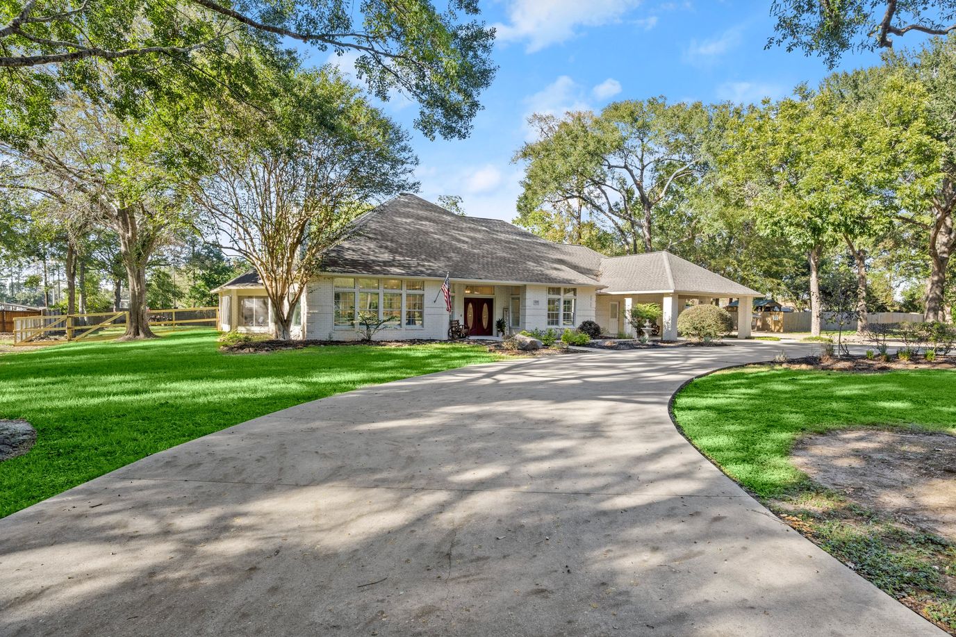 Exterior view of the assisted living facility surrounded by trees.