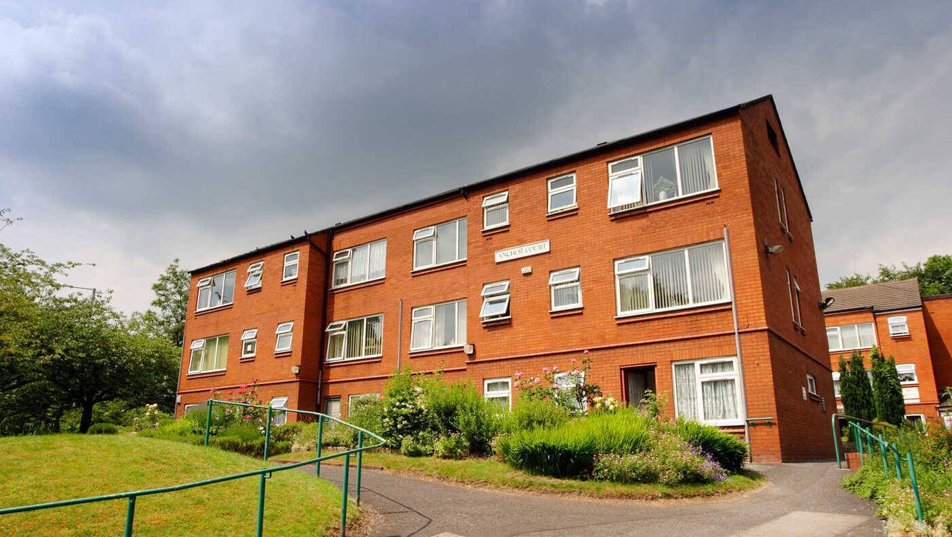 Exterior view of the Anchor Court facility with gardens