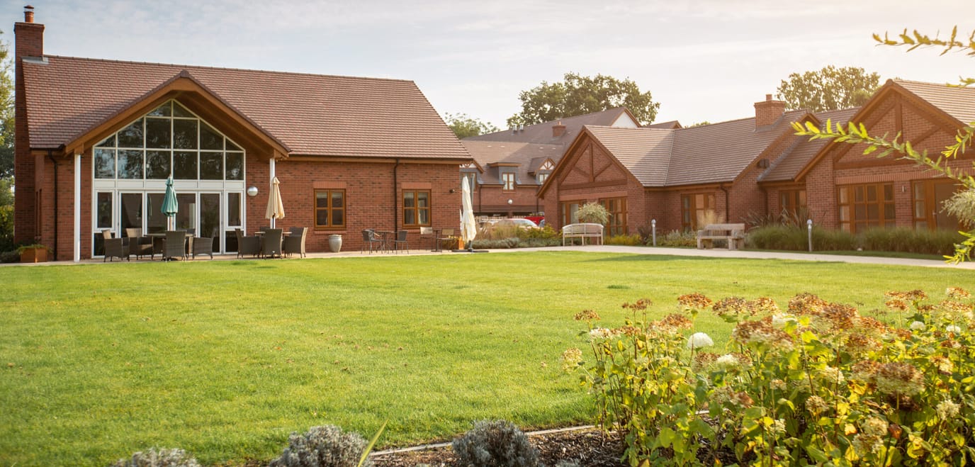 Outdoor view of the assisted living facility and gardens