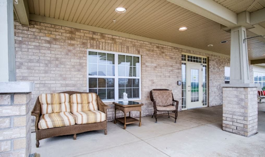 Exterior view of the facility's entrance with seating area