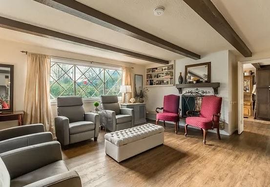 A bright living room with comfortable seating and decorative elements.