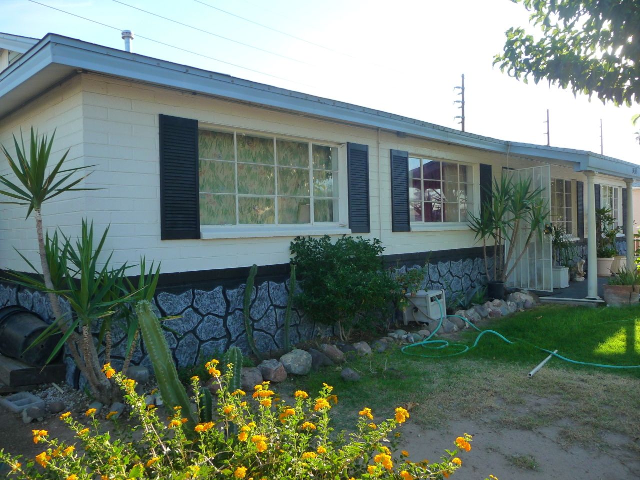 Exterior view of the facility showing gardens and building