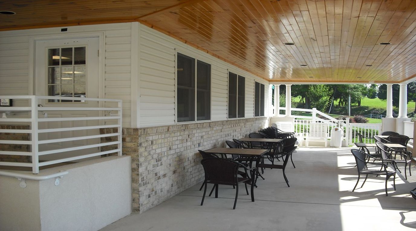 Outdoor patio area with tables and chairs
