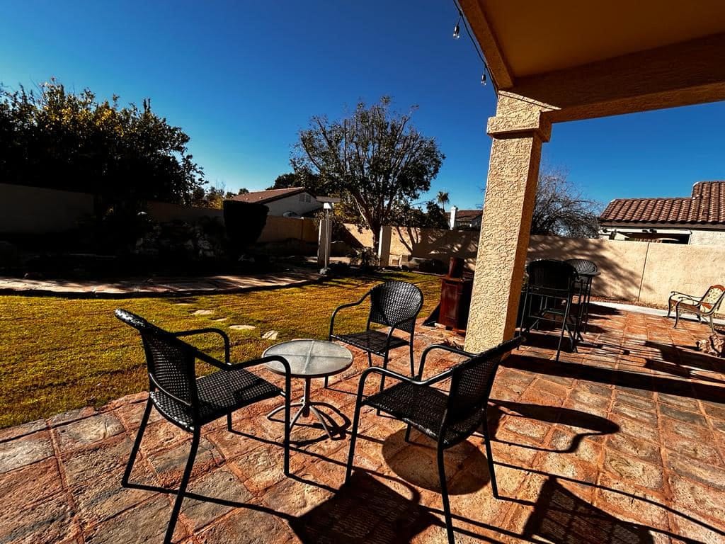 Outdoor patio area with chairs and table
