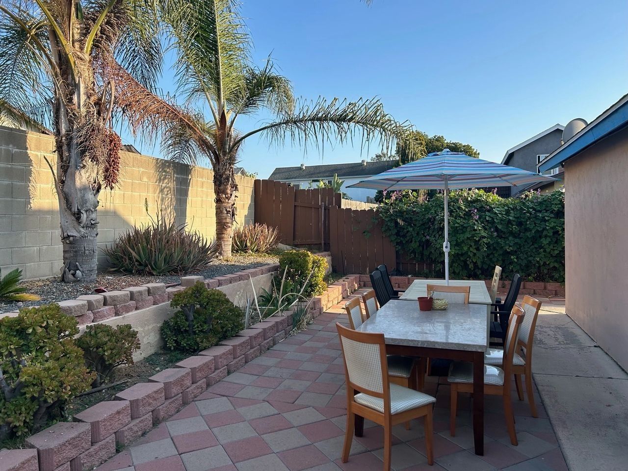 Outdoor dining area with table and umbrella