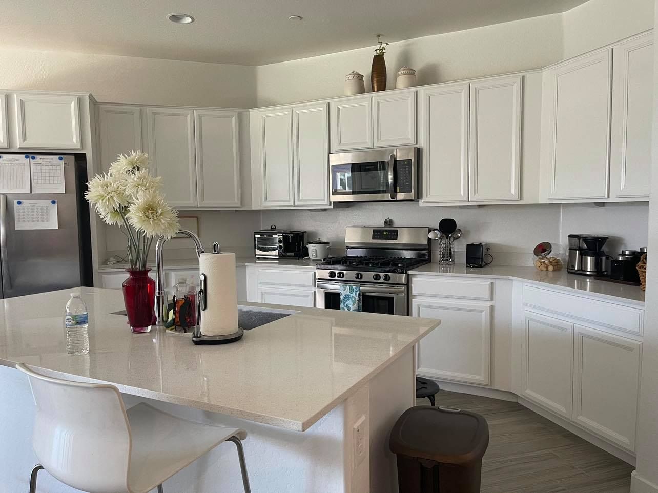 Bright kitchen view with modern appliances and decor