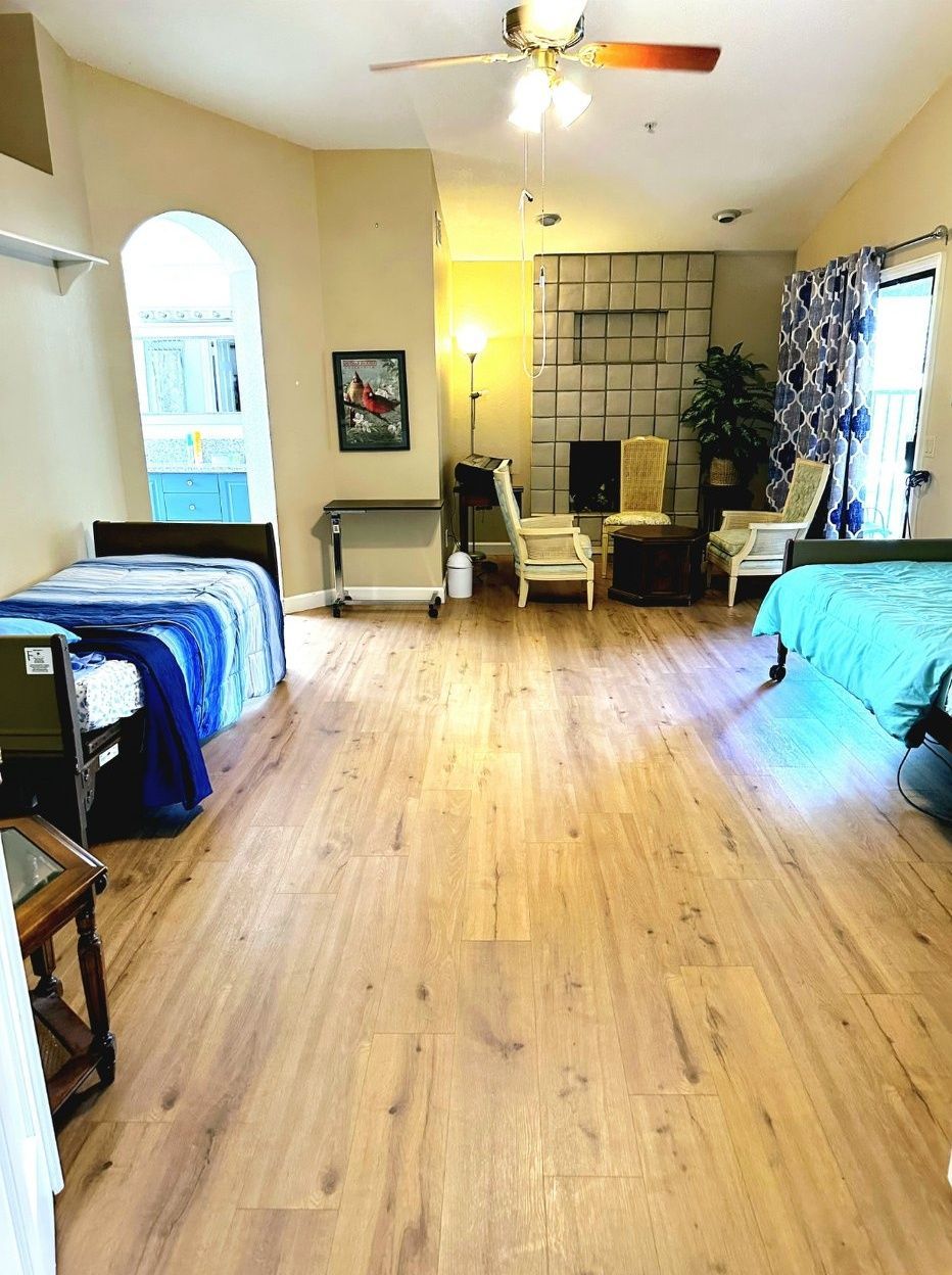Bright interior of a shared resident room with beds