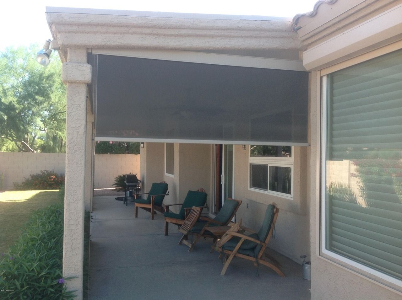 Outdoor patio with seating at assisted living facility