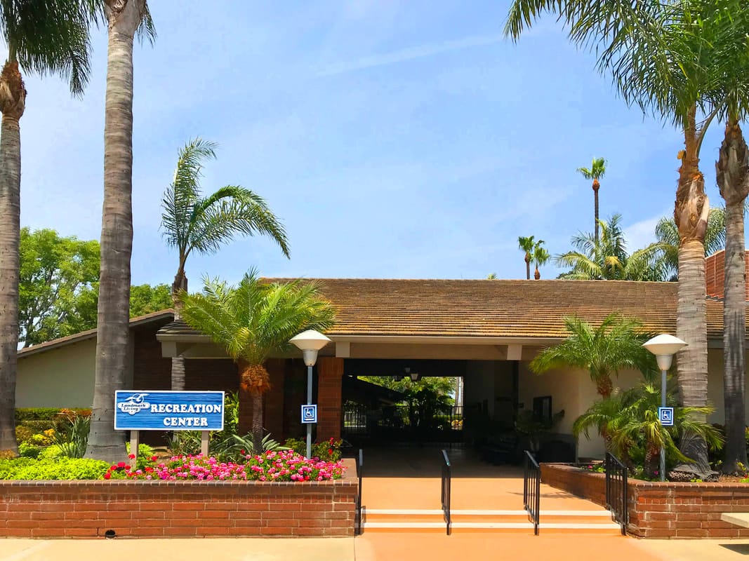 Exterior view of the recreation center with palm trees
