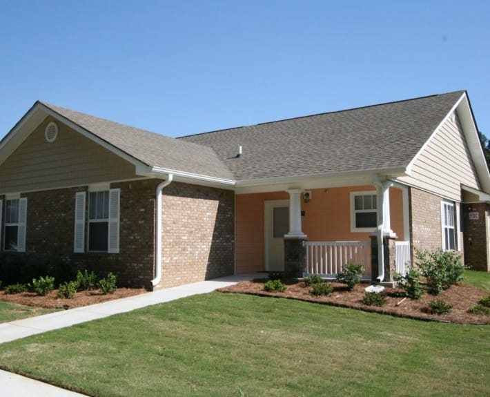 Exterior view of a facility building with landscaping
