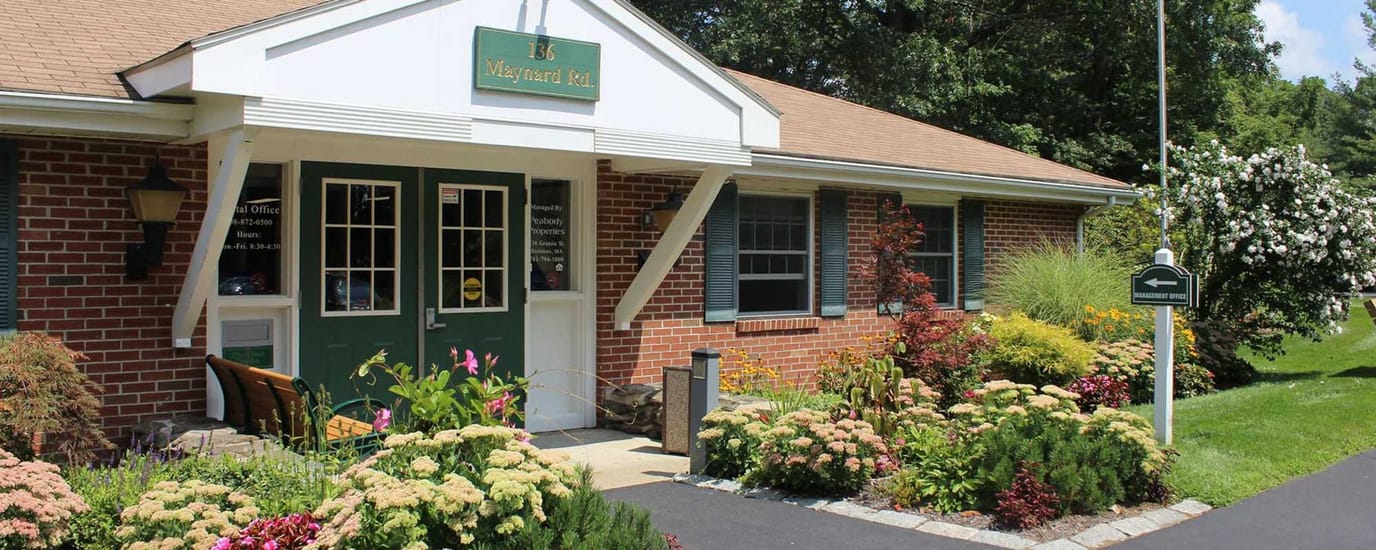 Exterior view of the assisted living facility with garden