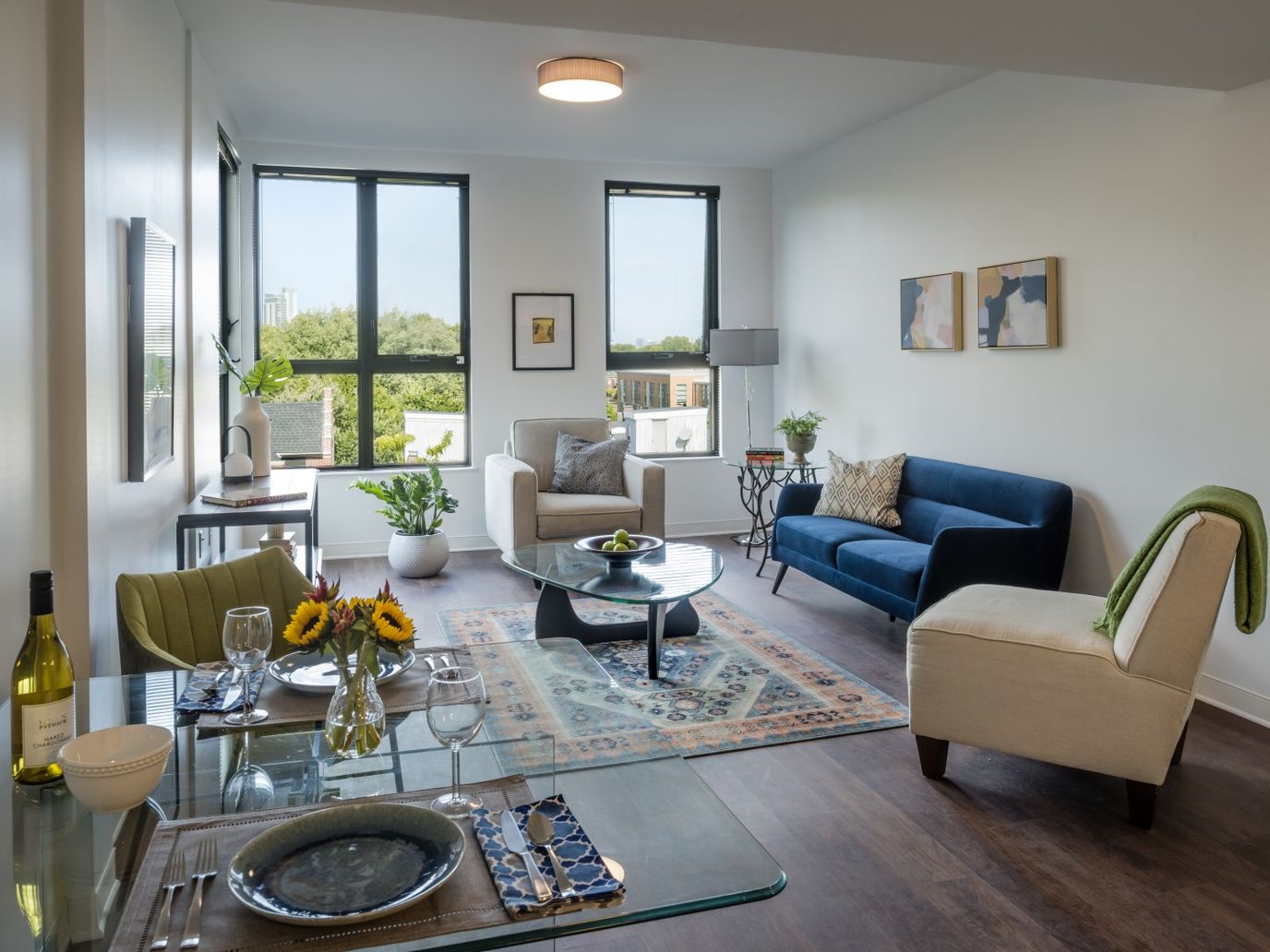 Bright living room with cozy furniture and a dining table