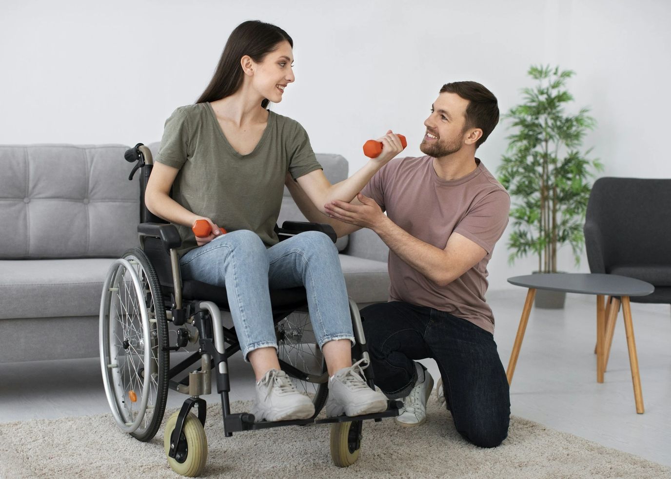 Therapist assisting a resident with weights