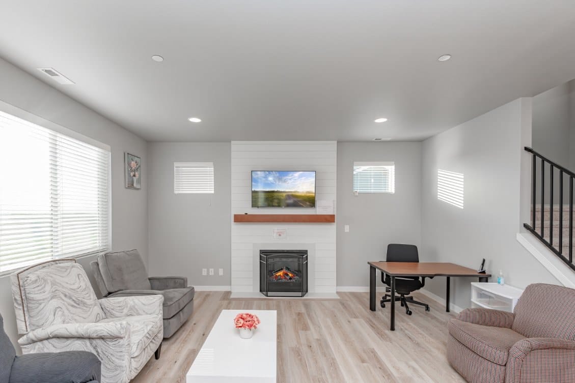 Cozy common area with seating and a fireplace