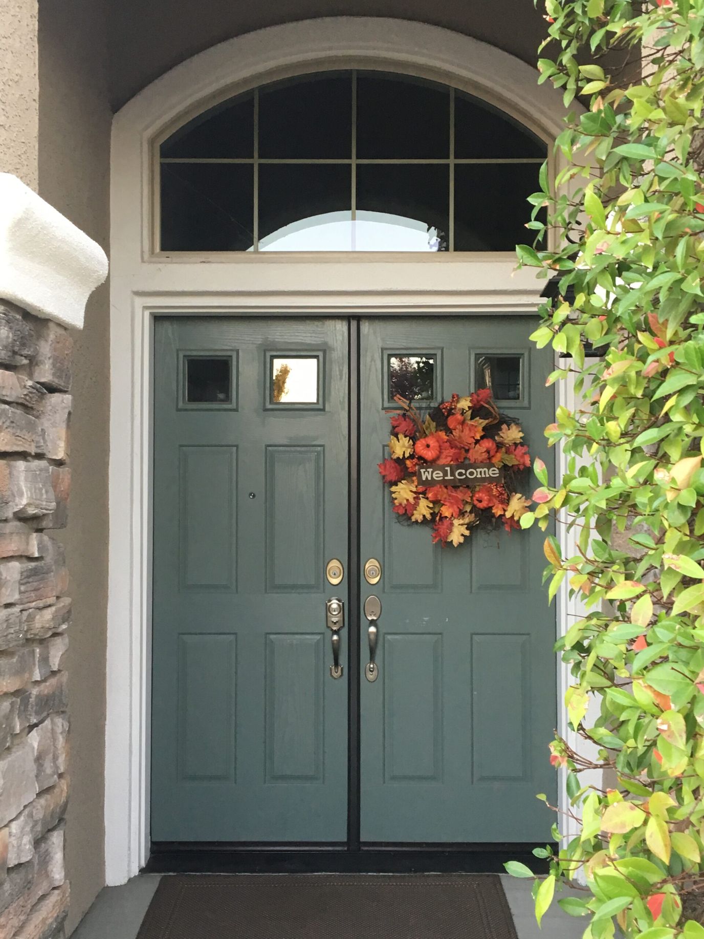 Exterior entrance with a welcoming wreath