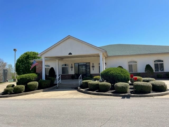 Front entrance of Oakdale Care Center with landscaping