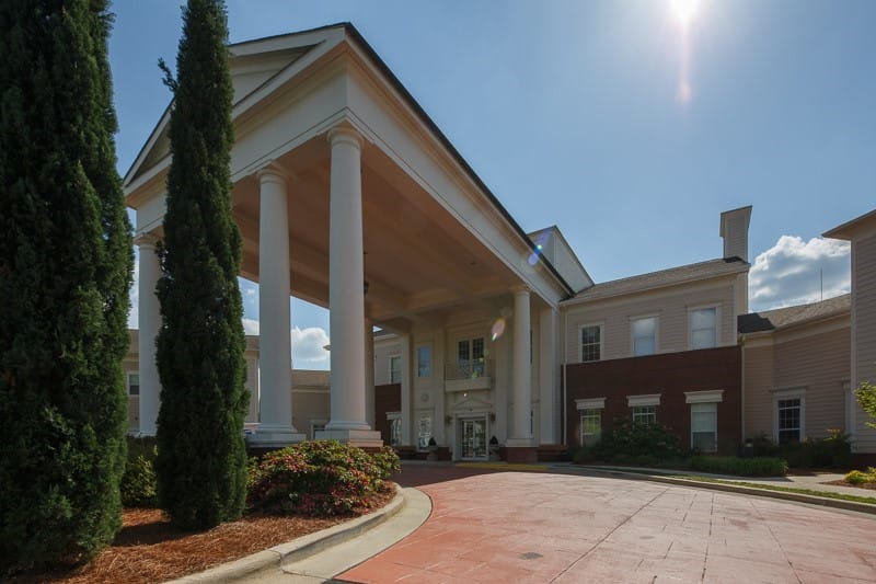 Exterior view of OakBridge Terrace entrance with columns