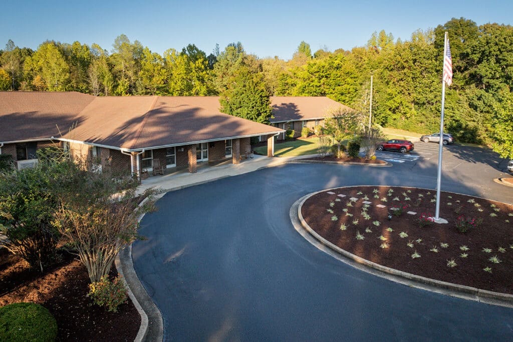 Exterior view of a nursing home facility with landscaping