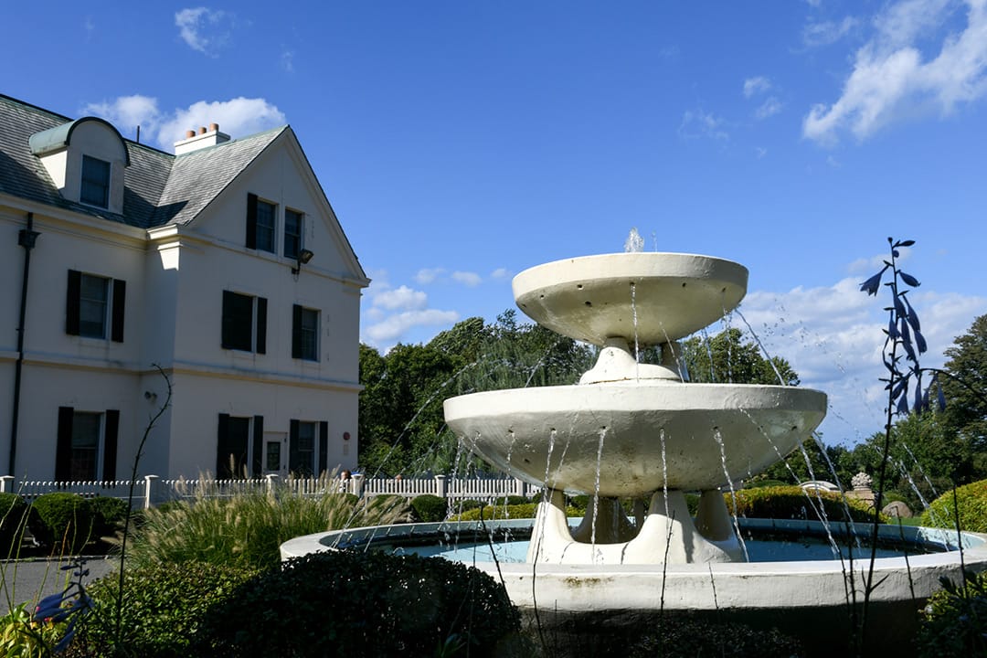 Outdoor fountain feature by the facility exterior