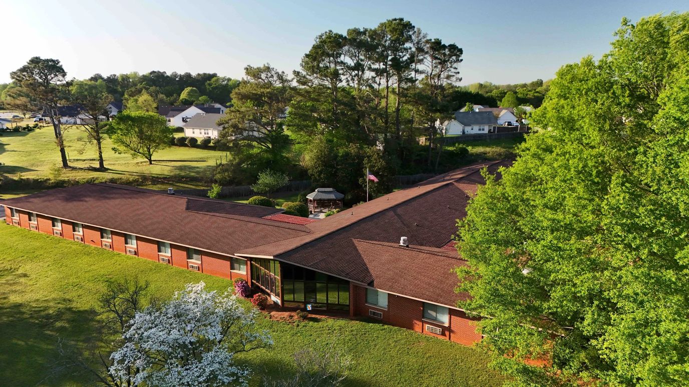 Aerial view of Hill Haven Nursing Home surrounded by greenery