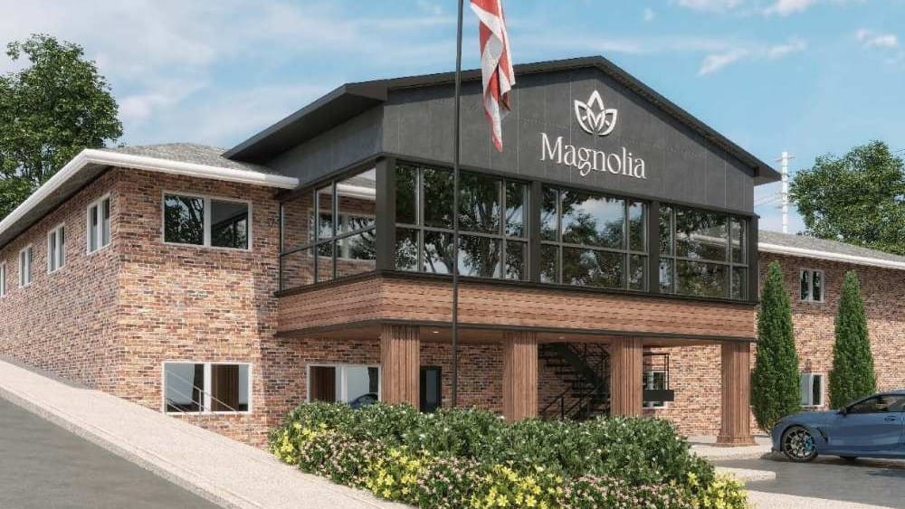 Exterior view of Magnolia Healthcare facility with logo