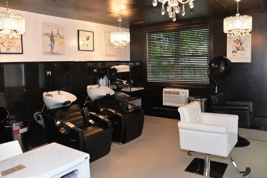 Interior view of a stylish salon with washing stations