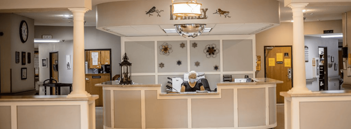 Reception area with staff at the front desk
