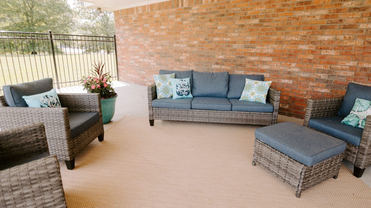 Outdoor seating area with comfortable furniture and plants