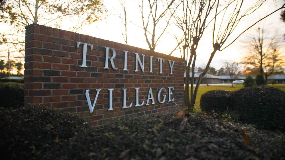 Trinity Village sign in front of the facility