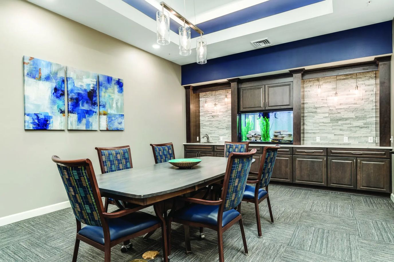 Common area with a dining table and artwork