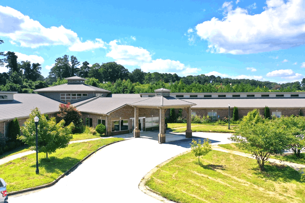 Entrance of Elderville Assisted Living with landscaped area