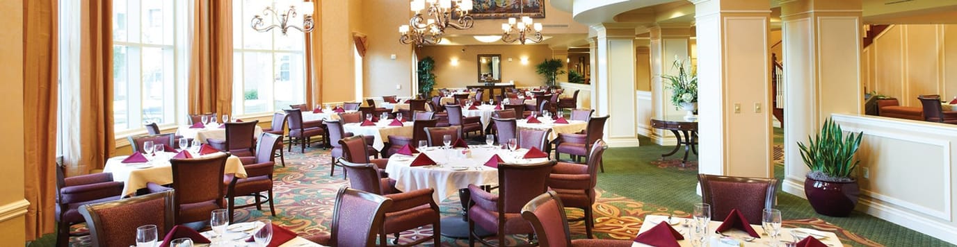 Elegant dining room setup with tables and chairs