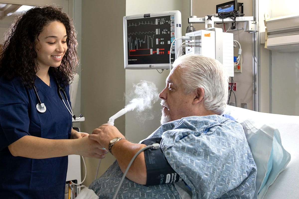 Nurse assisting a patient in a hospital room