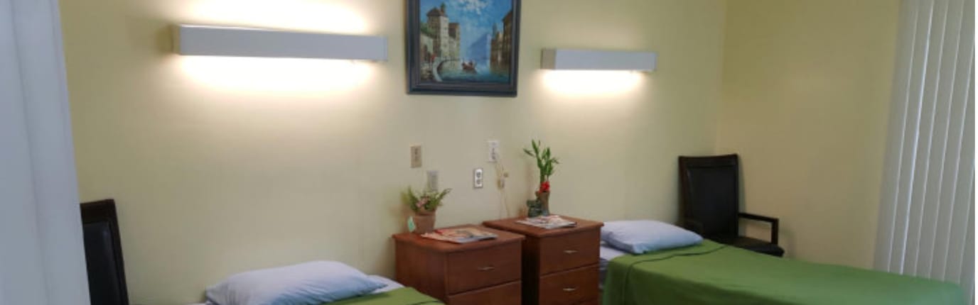 Cozy resident room with twin beds and decor