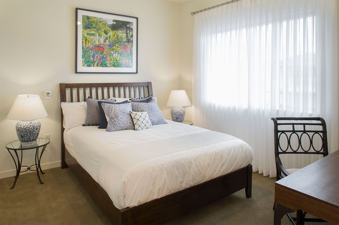 Cozy interior of a resident room with a bed and decor