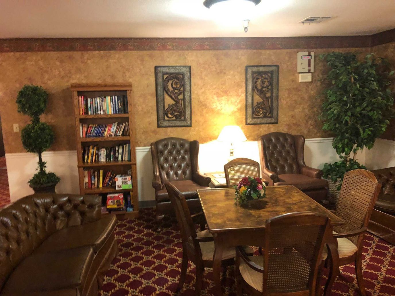 Cozy common area with bookshelves and seating
