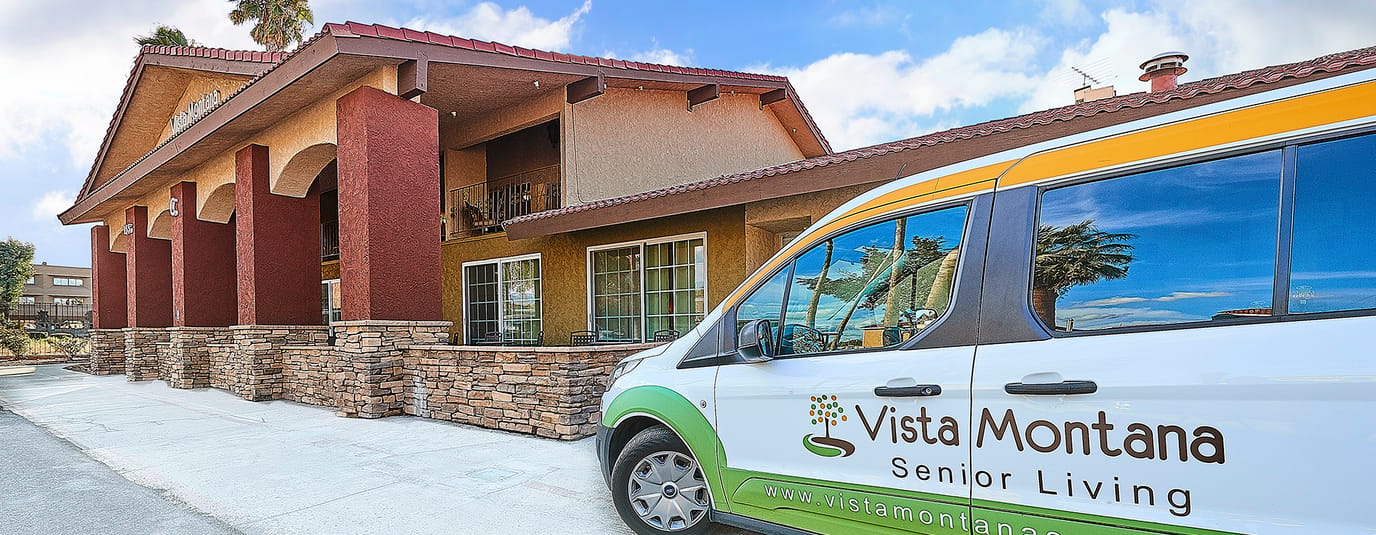 Facility building entrance with branded vehicle