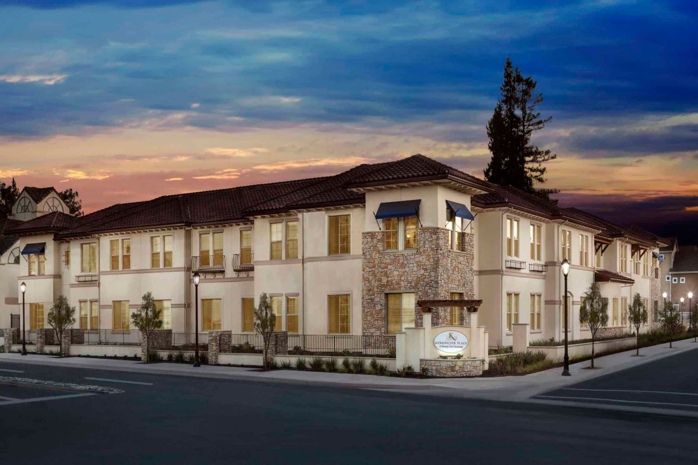 Exterior view of Kensington Place Redwood City at sunset