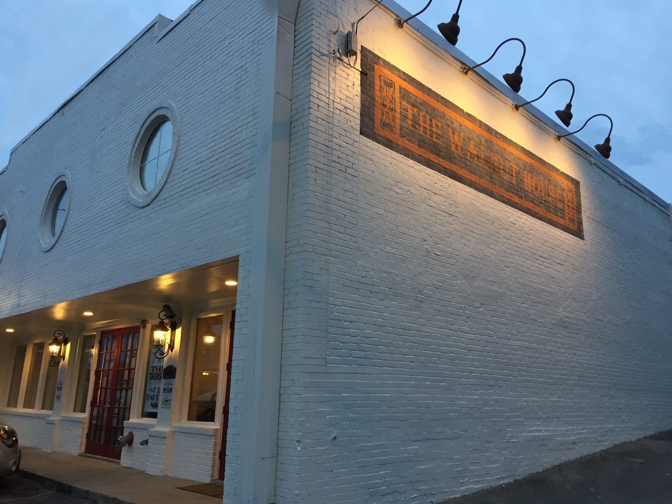 Exterior view of Walnut House on a clear evening
