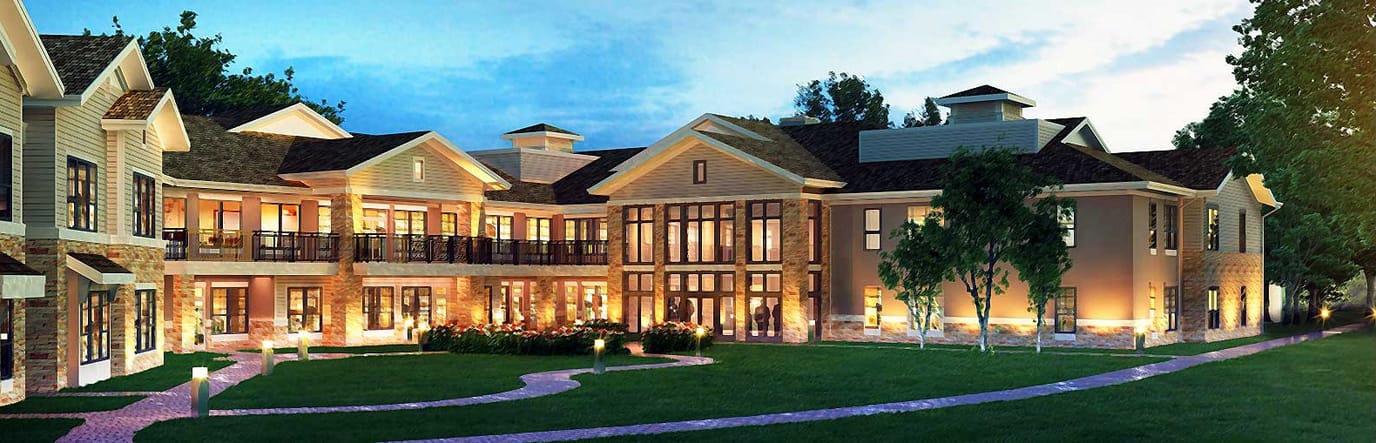 Exterior view of an assisted living facility at dusk
