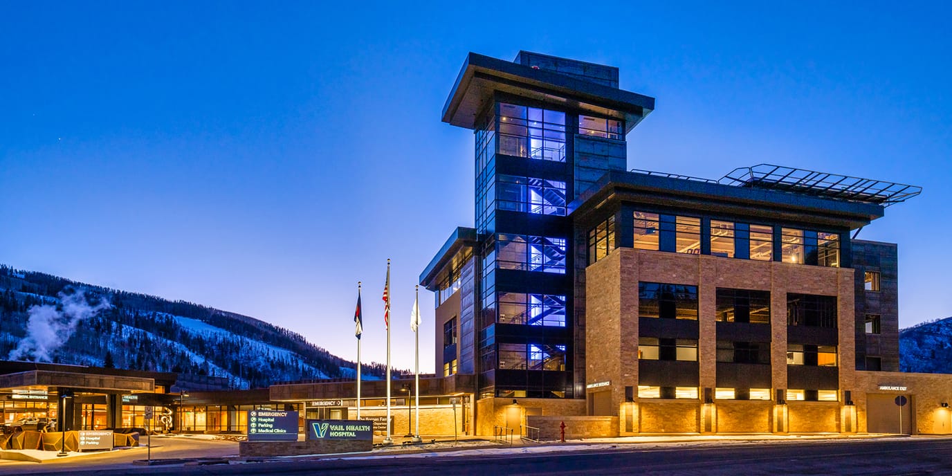 Exterior view of Vail Health Hospital at dusk