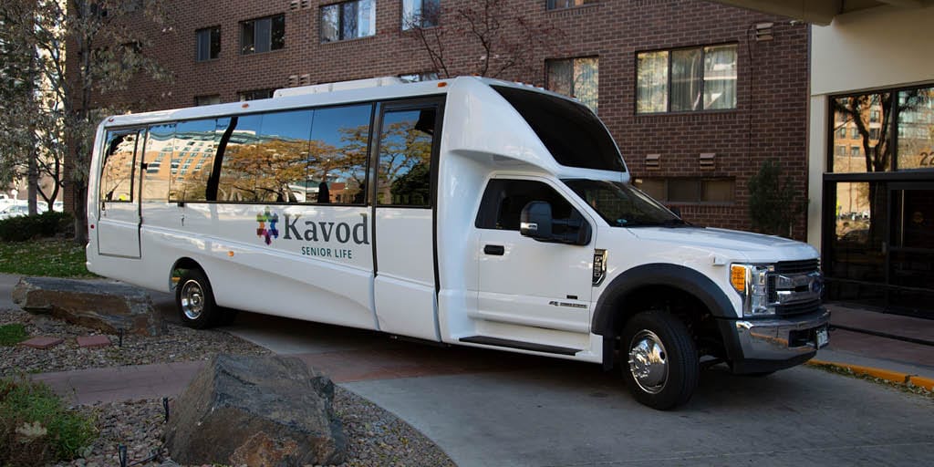 Facility transport van parked outside the building