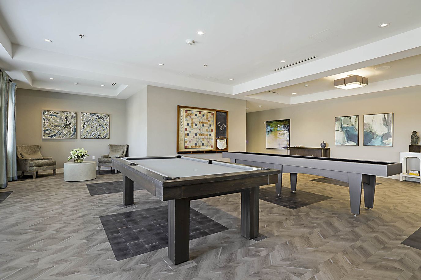 Bright common area with pool table and seating