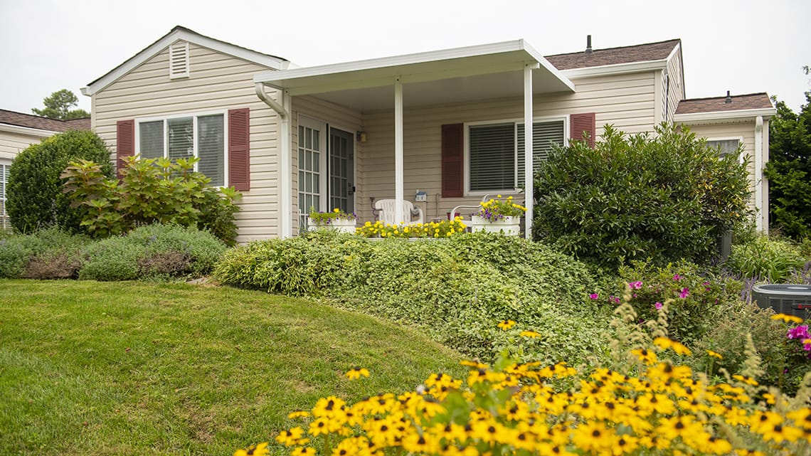 Exterior view of a cozy residence with flowers