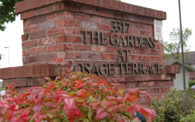 Exterior sign of The Gardens at Osage Terrace