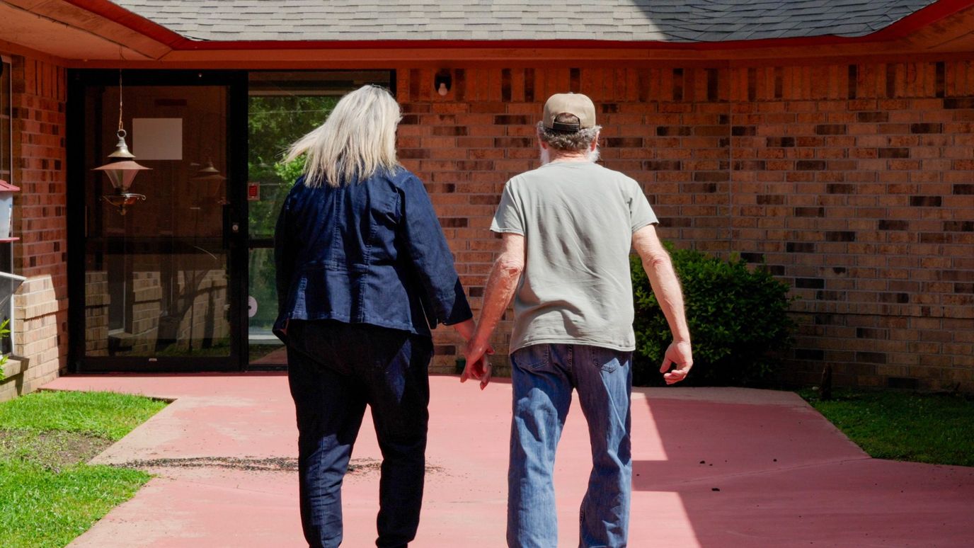 Couple walking towards the facility entrance